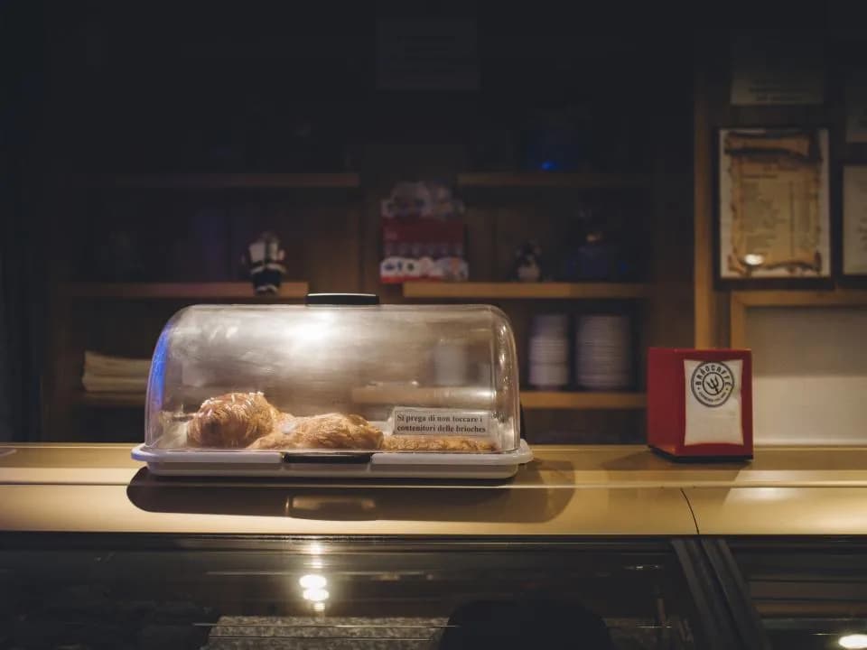 Fresh pastries displayed at a cafe and bakery counter