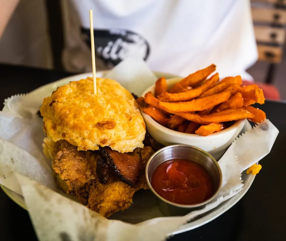 Fast-casual meal of a fried chicken sandwich and sweet potato fries